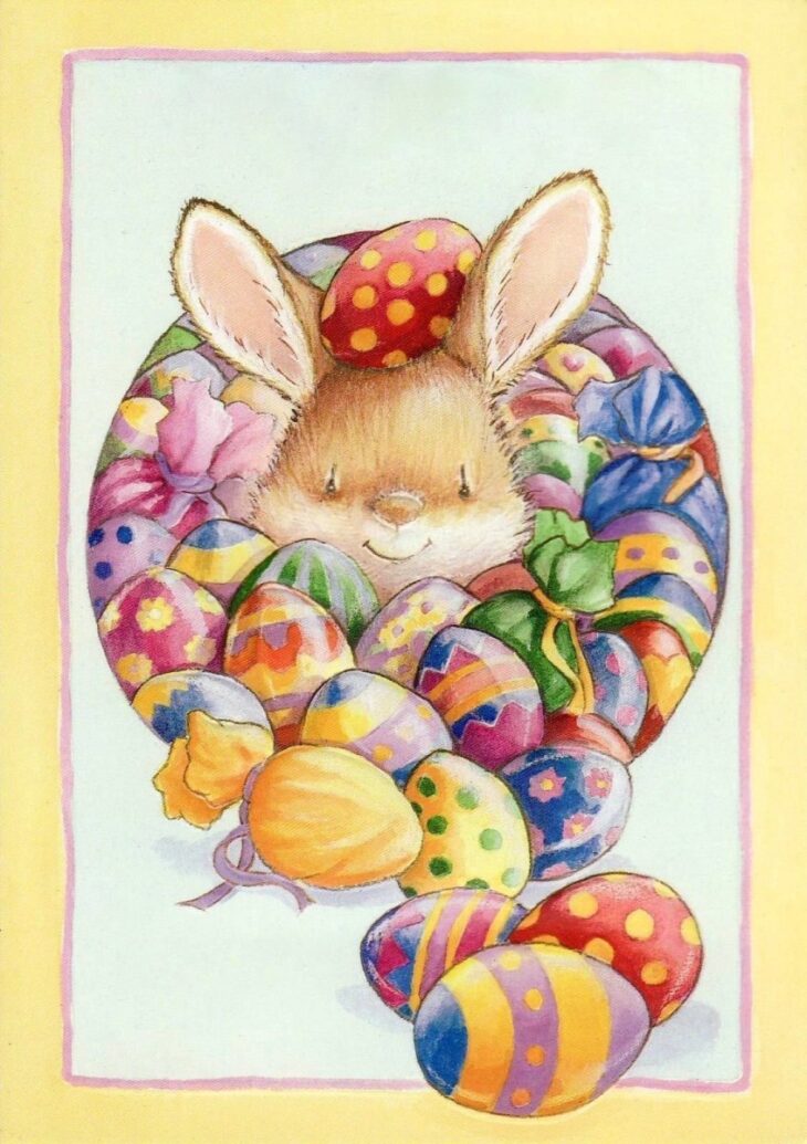 милая открытка с пасхальным кроликом и разноцветными яйцами
