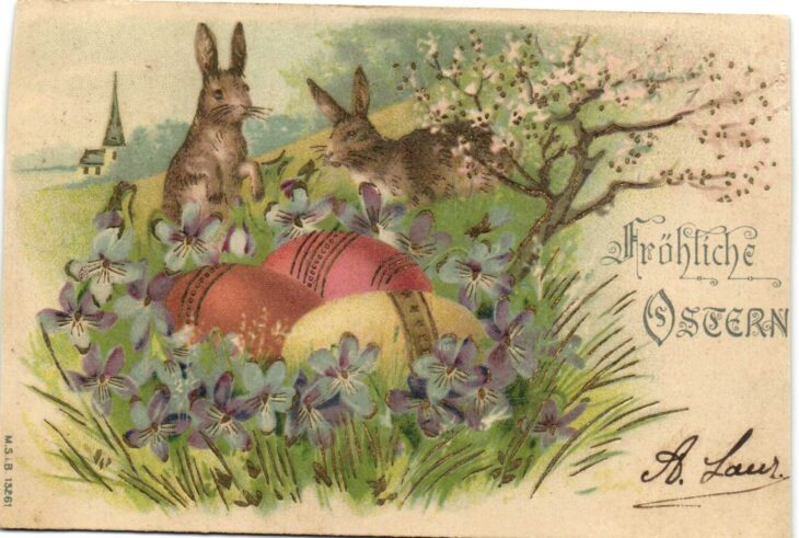 Пасхальная открытка с зайцами и яйцами