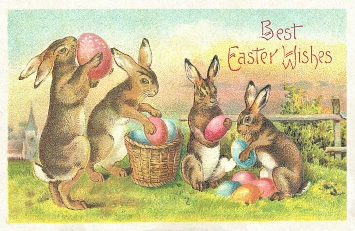Пасхальные кролики с яйцами и поздравительной надписью